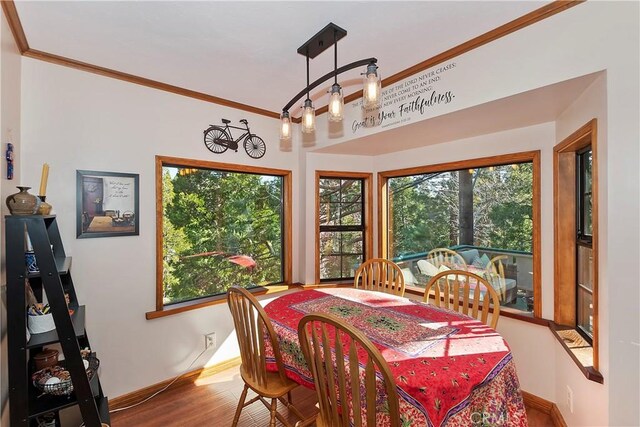 292 Heliotrope Dr, Lake Arrowhead, CA 92352 - dining area with ornamental molding, healthy amount of natural light, and wood finished floors