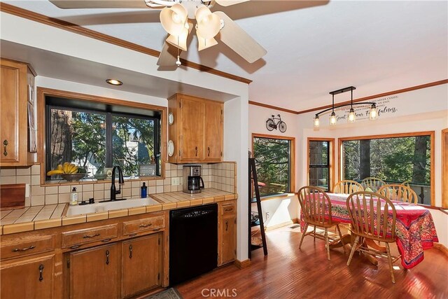 292 Heliotrope Dr, Lake Arrowhead, CA 92352 - kitchen featuring dishwasher, ornamental molding, backsplash, dark wood-style flooring, and healthy amount of natural light