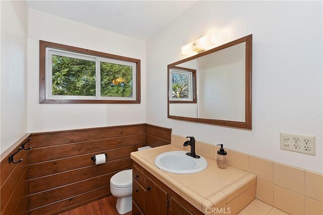 292 Heliotrope Dr, Lake Arrowhead, CA 92352 - half bath featuring vanity and a wainscoted wall