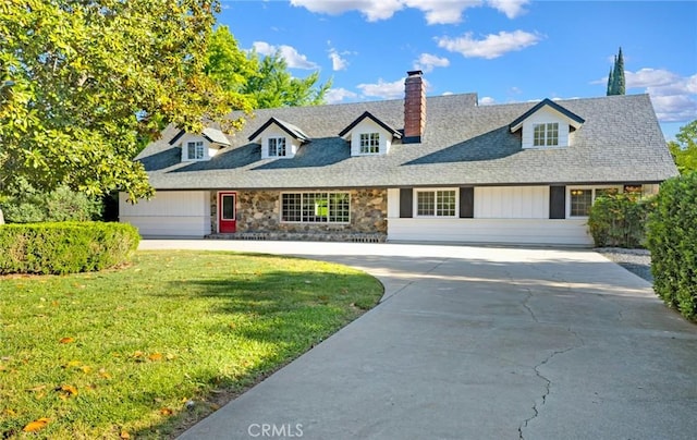 1785 Durham Dayton, Durham, CA 95938 - view of front facade featuring a chimney, stone siding, a front yard, a shingled roof, and concrete driveway