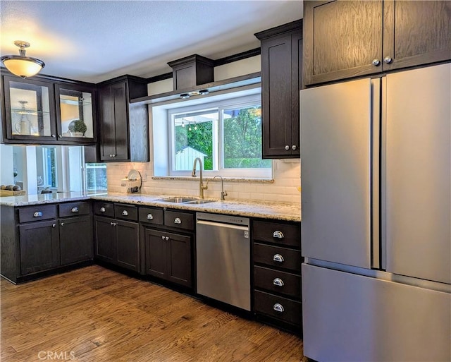 1785 Durham Dayton, Durham, CA 95938 - kitchen with appliances with stainless steel finishes, tasteful backsplash, light stone counters, and dark wood finished floors