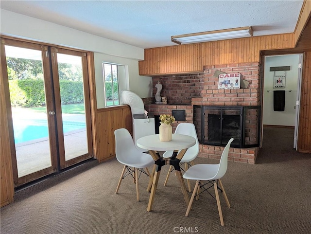 1785 Durham Dayton, Durham, CA 95938 - dining room with carpet flooring, wooden walls, and a brick fireplace