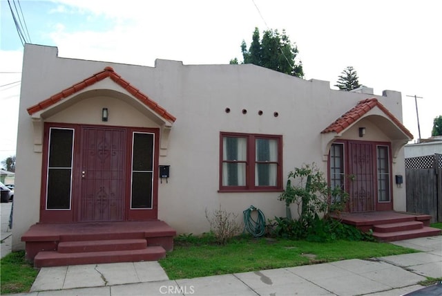 4316 E Wehrle Ct, Long Beach, CA 90804 - mediterranean / spanish home featuring stucco siding and a tile roof