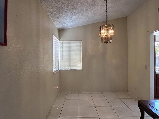 3010 Parkside Pl, San Diego, CA 92139 - unfurnished dining area with a chandelier, a textured ceiling, and light tile patterned floors