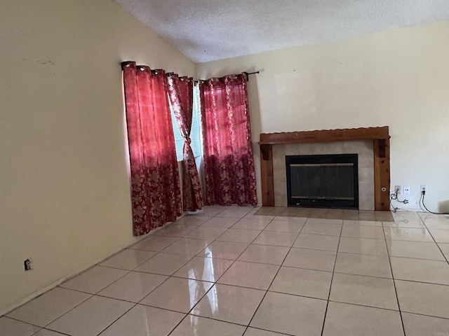 3010 Parkside Pl, San Diego, CA 92139 - unfurnished living room with a textured ceiling, tile patterned flooring, and a fireplace