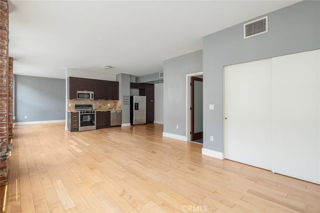 460 S Spring St Unit 1013, Los Angeles, CA 90013 - unfurnished living room with light wood-style flooring