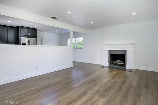 1319 E Monroe Ave, Orange, CA 92867 - unfurnished living room with crown molding, wood finished floors, a fireplace with flush hearth, and recessed lighting