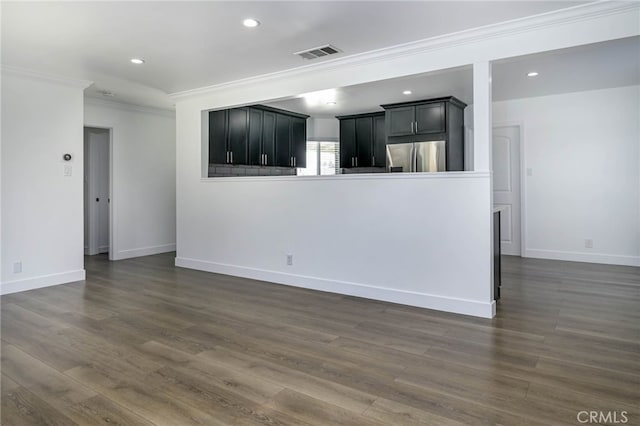 1319 E Monroe Ave, Orange, CA 92867 - unfurnished living room featuring crown molding, recessed lighting, and dark wood-style flooring