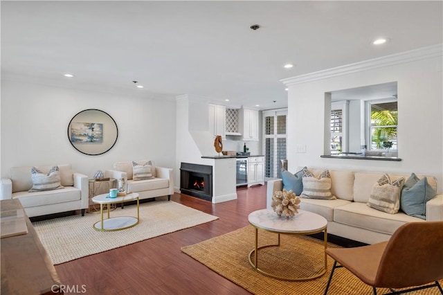 555 Esplanade Unit 320, Redondo Beach, CA 90277 - living room featuring a fireplace, crown molding, dark wood-type flooring, recessed lighting, and wine cooler