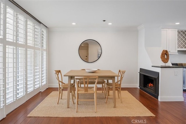 555 Esplanade Unit 320, Redondo Beach, CA 90277 - dining area with wood finished floors, crown molding, a large fireplace, and recessed lighting