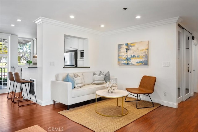 555 Esplanade Unit 320, Redondo Beach, CA 90277 - living area featuring wood finished floors, recessed lighting, and ornamental molding
