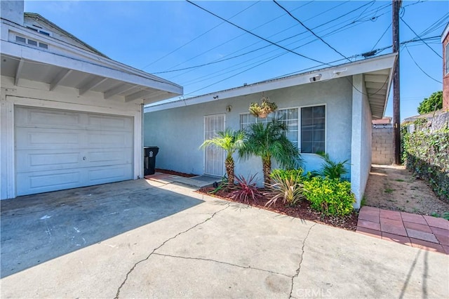 4430 W 166th St, Lawndale, CA 90260 - view of side of property with concrete driveway and stucco siding