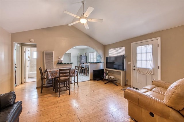 4430 W 166th St, Lawndale, CA 90260 - living area with arched walkways, vaulted ceiling, plenty of natural light, ceiling fan, and light wood-style flooring