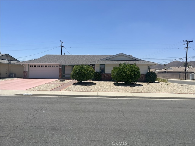 28957 Glen Oaks Dr, Menifee, CA 92586 - single story home with a garage, brick siding, concrete driveway, and a shingled roof