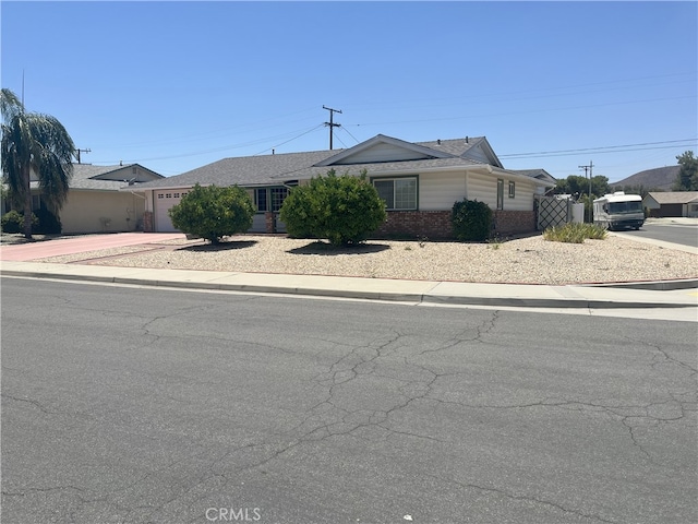 28957 Glen Oaks Dr, Menifee, CA 92586 - single story home with driveway, brick siding, and a garage