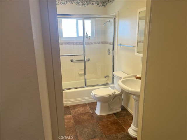 28957 Glen Oaks Dr, Menifee, CA 92586 - full bath featuring shower / bath combination with glass door and stone finish floors