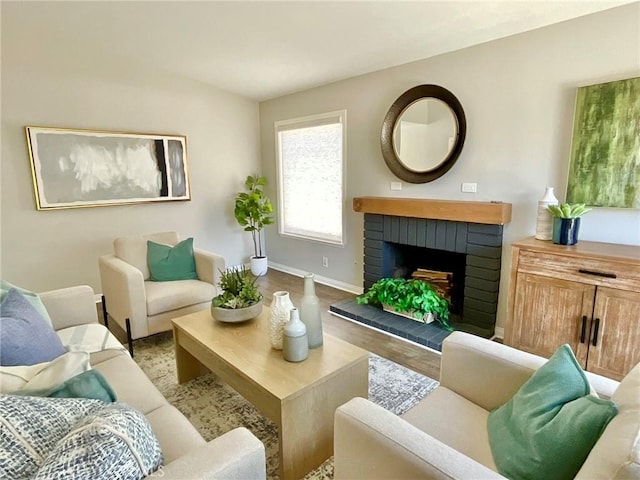 22801 Nolan St, Lake Forest, CA 92630 - living area with wood finished floors and a brick fireplace
