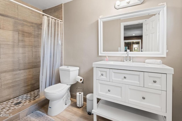 9818 Firebird Ave, Whittier, CA 90605 - full bath with vanity, a tile shower, and wood finished floors