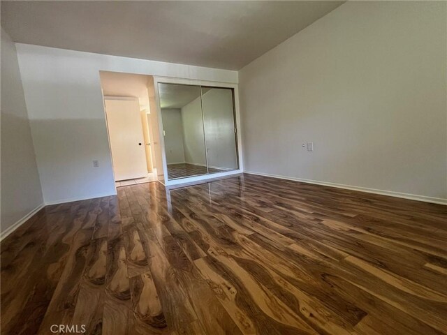 2268 Via Puerta Unit O, Laguna Woods, CA 92637 - unfurnished bedroom featuring wood finished floors and a closet