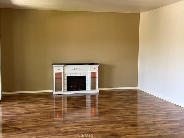 2268 Via Puerta Unit O, Laguna Woods, CA 92637 - unfurnished living room with wood finished floors and a fireplace