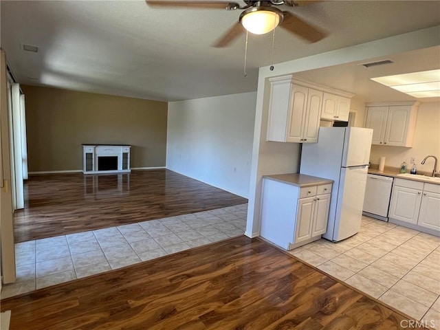 2268 Via Puerta Unit O, Laguna Woods, CA 92637 - kitchen featuring white appliances, light wood-style floors, ceiling fan, and open floor plan
