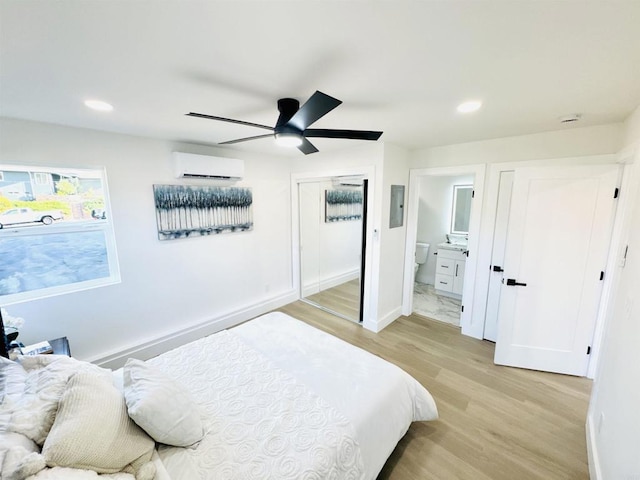 7118 Stanford Ave, La Mesa, CA 91942 - bedroom with an AC wall unit, light wood-type flooring, recessed lighting, ensuite bathroom, and ceiling fan