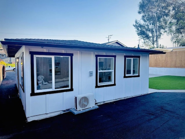 7118 Stanford Ave, La Mesa, CA 91942 - rear view of property with board and batten siding and a patio