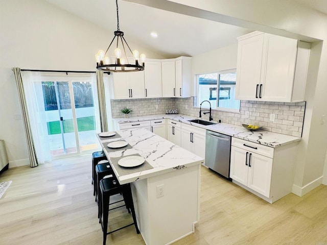 7118 Stanford Ave, La Mesa, CA 91942 - kitchen featuring stainless steel dishwasher, light wood-style floors, tasteful backsplash, a chandelier, and vaulted ceiling