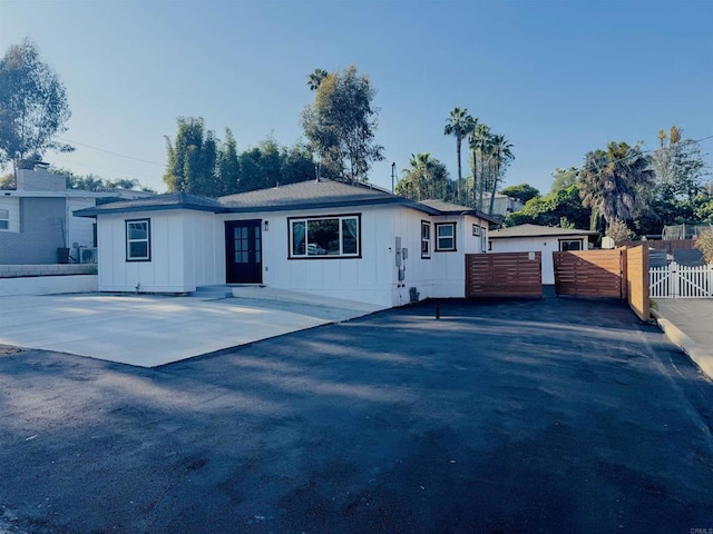 7118 Stanford Ave, La Mesa, CA 91942 - view of front facade featuring board and batten siding and a gate
