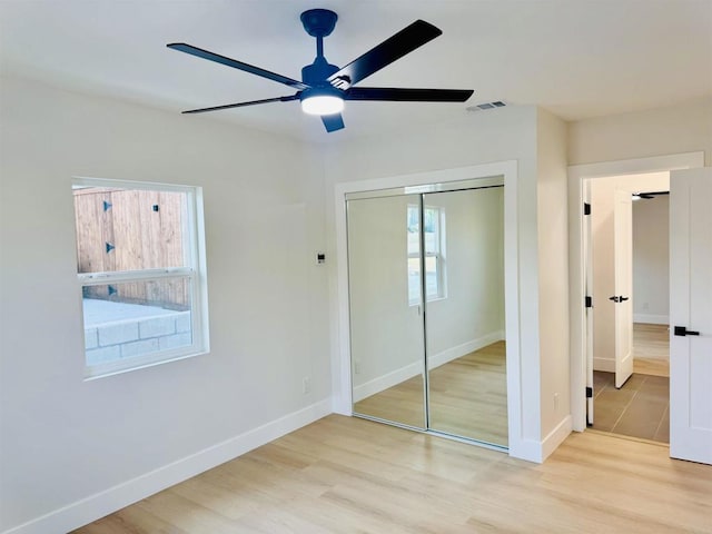 7118 Stanford Ave, La Mesa, CA 91942 - unfurnished bedroom featuring a closet, light wood-style flooring, and a ceiling fan