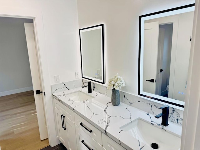 7118 Stanford Ave, La Mesa, CA 91942 - full bath featuring double vanity and wood finished floors