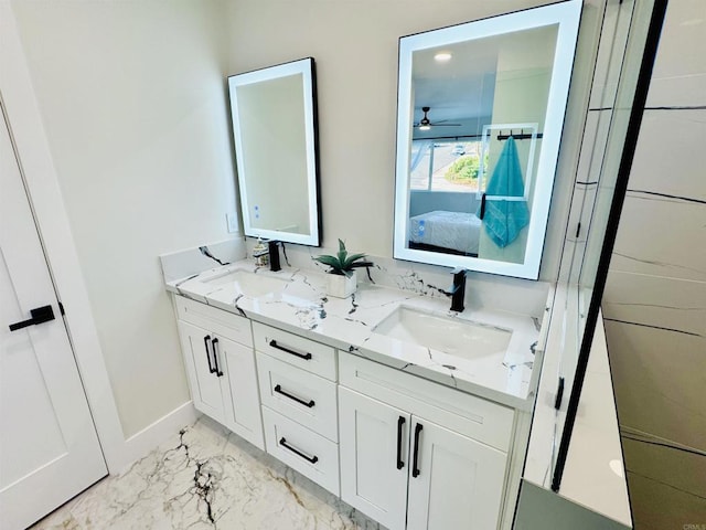 7118 Stanford Ave, La Mesa, CA 91942 - ensuite bathroom with double vanity, marble look tiles, and a ceiling fan