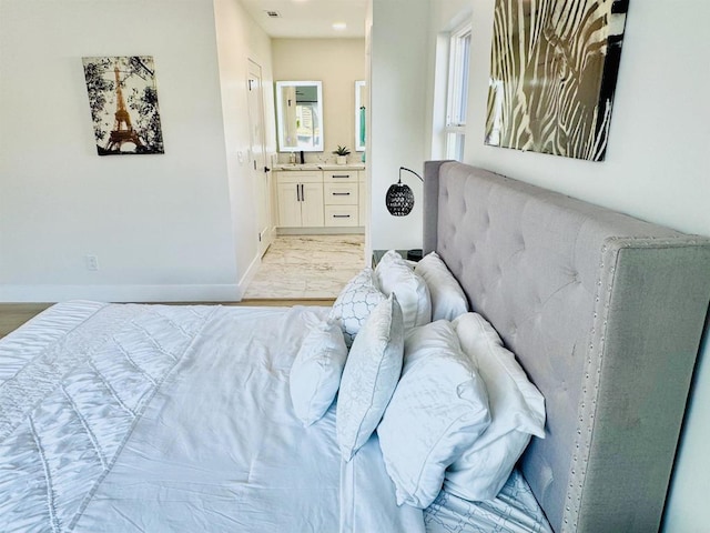 7118 Stanford Ave, La Mesa, CA 91942 - bedroom with ensuite bathroom and light wood-style floors