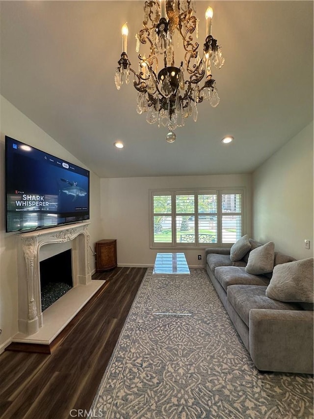 13191 Honeybee St, Moorpark, CA 93021 - living area with dark wood-style floors, a chandelier, recessed lighting, vaulted ceiling, and a premium fireplace