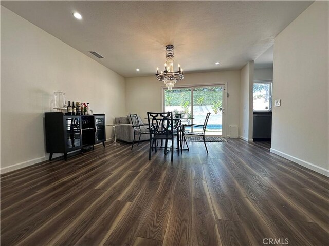 13191 Honeybee St, Moorpark, CA 93021 - dining space with dark wood finished floors, a chandelier, and recessed lighting