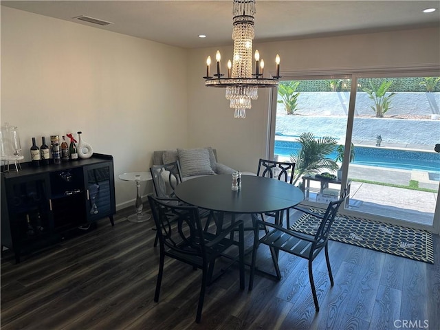 13191 Honeybee St, Moorpark, CA 93021 - dining space featuring dark wood-style flooring, recessed lighting, and a chandelier