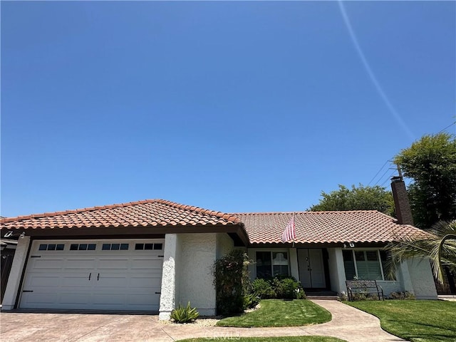 13191 Honeybee St, Moorpark, CA 93021 - view of front of home with a tiled roof, stucco siding, an attached garage, driveway, and a front lawn