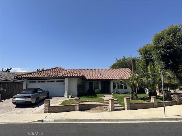 13191 Honeybee St, Moorpark, CA 93021 - view of front facade featuring a tiled roof, driveway, stucco siding, and an attached garage
