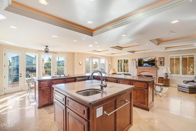 2110 Ravoli Dr, Oxnard, CA 93035 - kitchen with a center island with sink, open floor plan, crown molding, brown cabinetry, and recessed lighting
