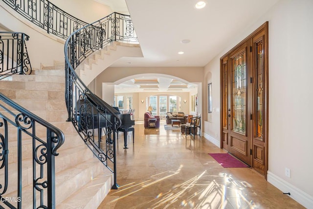 2110 Ravoli Dr, Oxnard, CA 93035 - entrance foyer featuring arched walkways, stairs, recessed lighting, decorative columns, and marble finish flooring