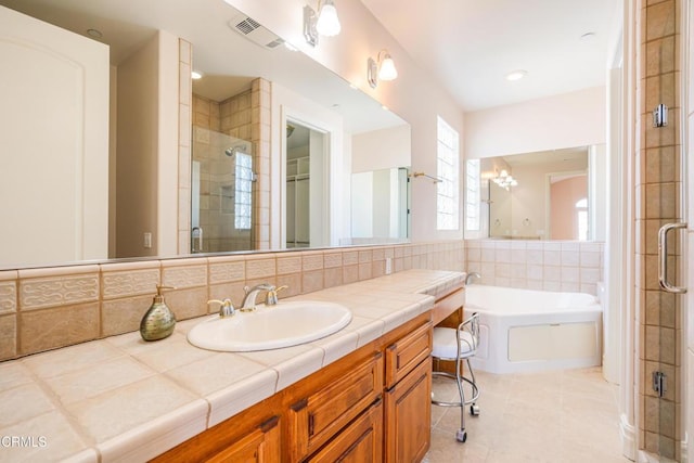 2110 Ravoli Dr, Oxnard, CA 93035 - bathroom featuring a stall shower, vanity, a garden tub, and tile patterned floors