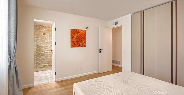 26144 Kenrose Cir, Calabasas, CA 91302 - bedroom with light wood finished floors and connected bathroom