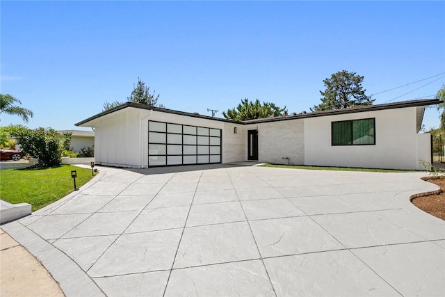 26144 Kenrose Cir, Calabasas, CA 91302 - view of front of property with concrete driveway, an attached garage, and a front yard