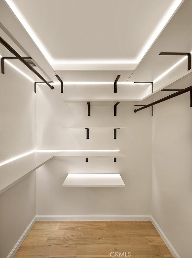 26144 Kenrose Cir, Calabasas, CA 91302 - walk in closet with light wood-style floors