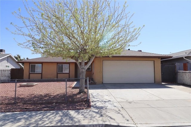 37334 55th St E, Palmdale, CA 93552 - ranch-style house featuring a garage, driveway, and stucco siding