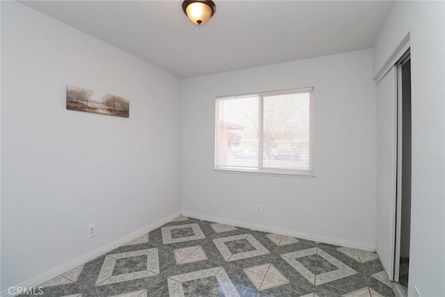 37334 55th St E, Palmdale, CA 93552 - unfurnished bedroom featuring baseboards and a closet