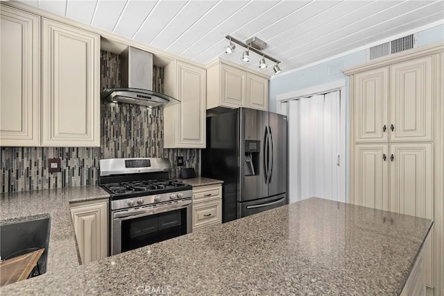 23711 Whale Cv, Laguna Niguel, CA 92677 - kitchen with stainless steel appliances, cream cabinetry, wall chimney range hood, and stone counters