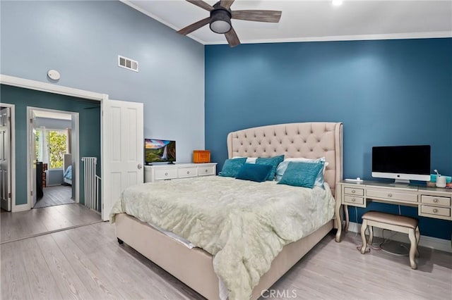 23711 Whale Cv, Laguna Niguel, CA 92677 - bedroom with wood finished floors, high vaulted ceiling, a ceiling fan, and ornamental molding