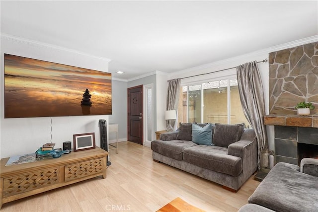 23711 Whale Cv, Laguna Niguel, CA 92677 - living area with crown molding, light wood-type flooring, and a fireplace