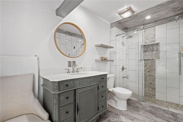 23711 Whale Cv, Laguna Niguel, CA 92677 - full bathroom featuring vanity, a shower stall, and wood finished floors